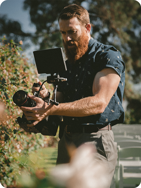 image of a Wedding Videographer shooting a wedding