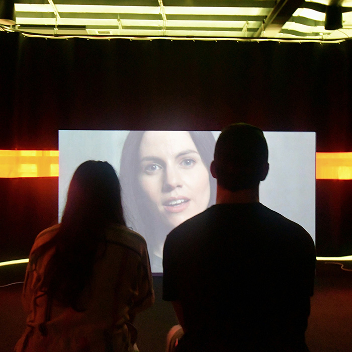 image of a couple watching their wedding video